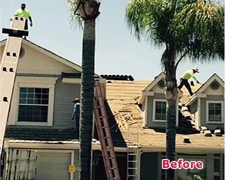 Roof mid tear-off during a Jarco re-roof, crew on the roof